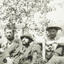 Photograph of commissioners Stewart and McMartin and their party sitting near a lake, July 1906